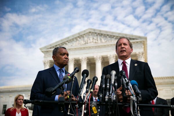 Karl Racine, attorney general of Washington, D.C., left, and Ken Paxton, attorney general of Texas, spoke about the investigation into Google last year.