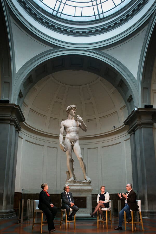 Some members of the team behind the 3-D replica project in front of Michelangelo’s David in Florence, Italy, on Wednesday.